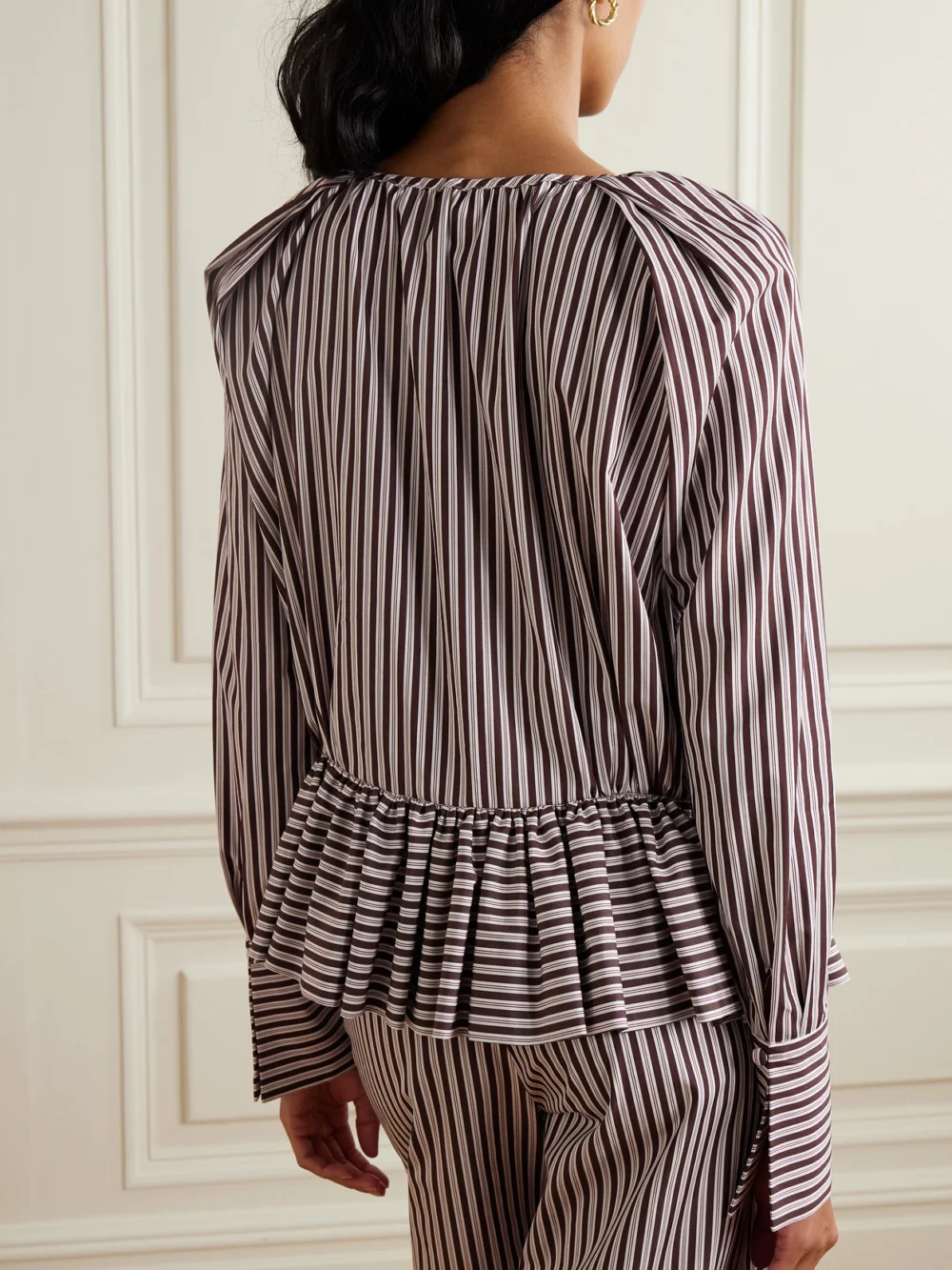 Back view of the Liberowe + the Vanguard Striped Cotton-poplin Peplum Blouse