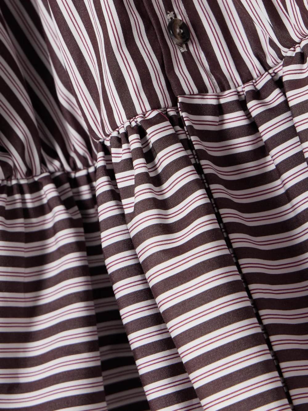 Close-up detail of the Liberowe + the Vanguard Striped Cotton-poplin Peplum Blouse