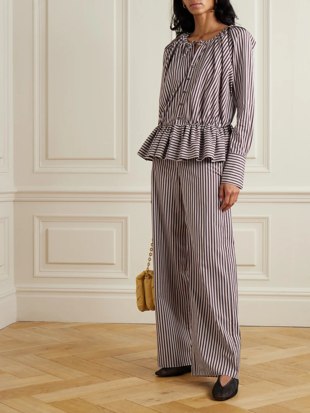 Liberowe + the Vanguard Striped Cotton-poplin Peplum Blouse, worn by a model