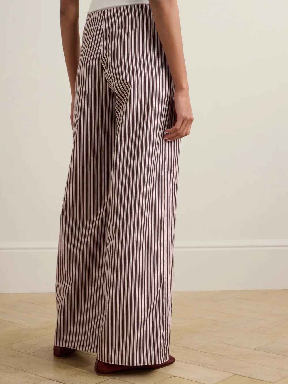 Back view of the Liberowe + the Vanguard Striped Cotton-poplin Wide-leg Pants