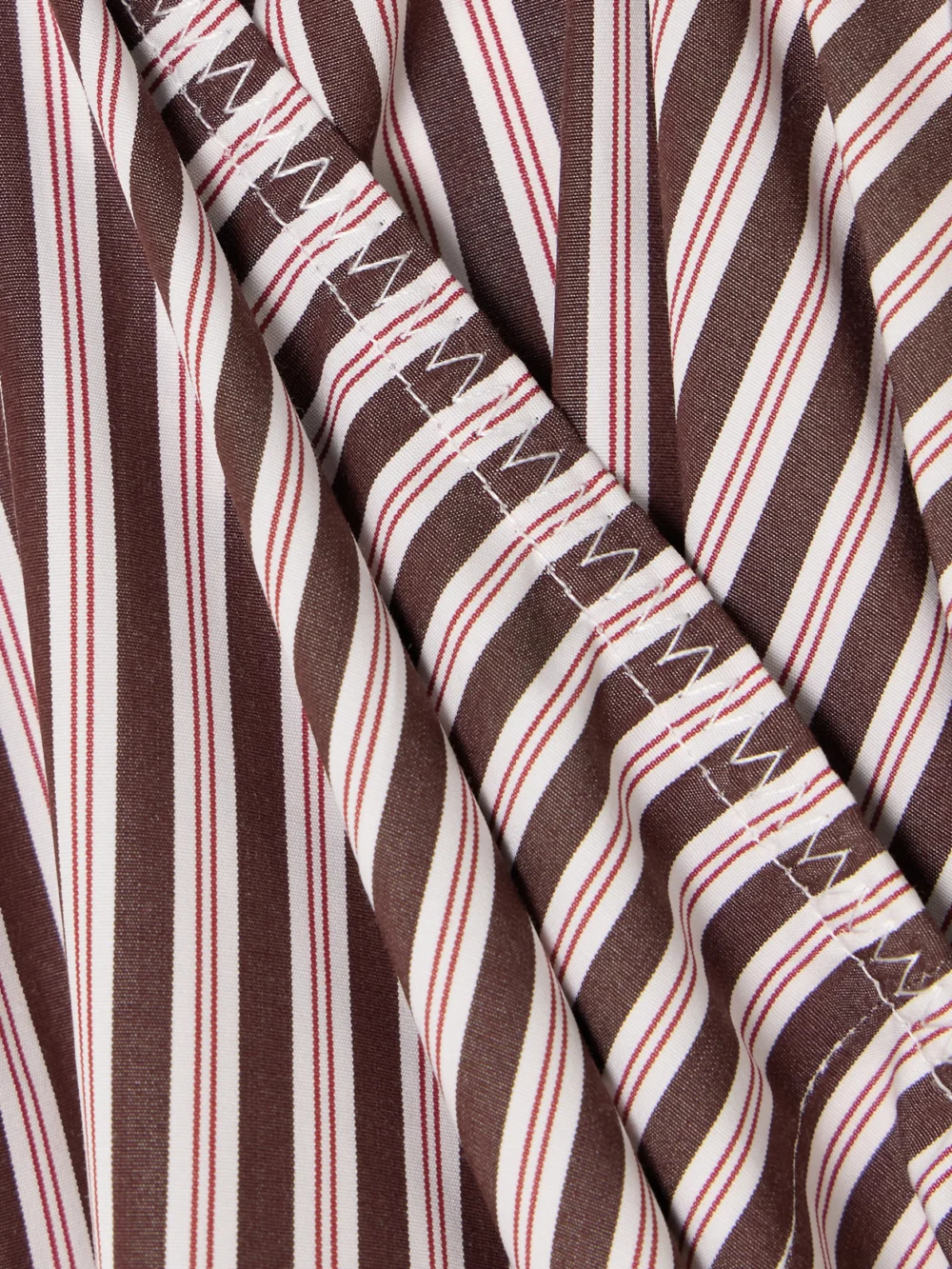 Close-up detail of the Liberowe + the Vanguard Striped Cotton-poplin Wide-leg Pants