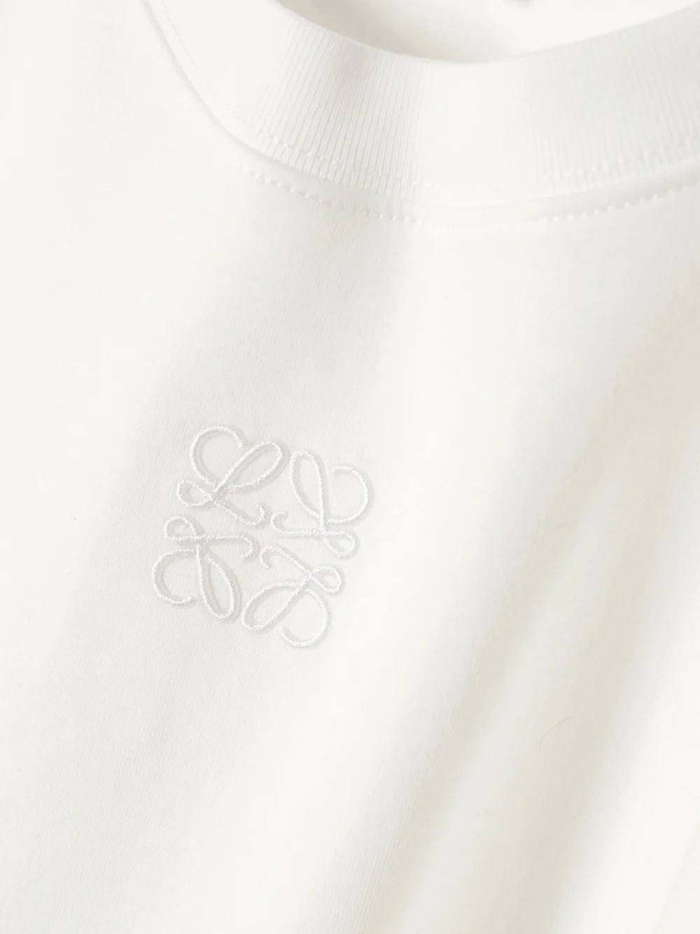 Close-up detail of the Loewe Anagram Asymmetric Cotton-blend Jersey T-shirt