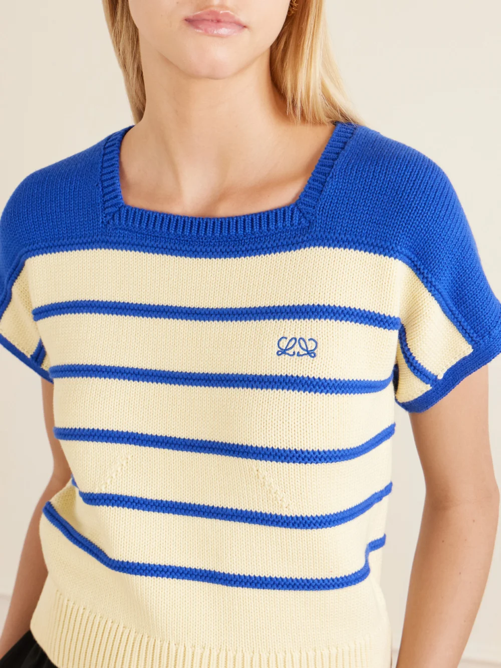 Close-up detail of the Loewe Anagram-embroidered Striped Cotton and Wool-blend Sweater