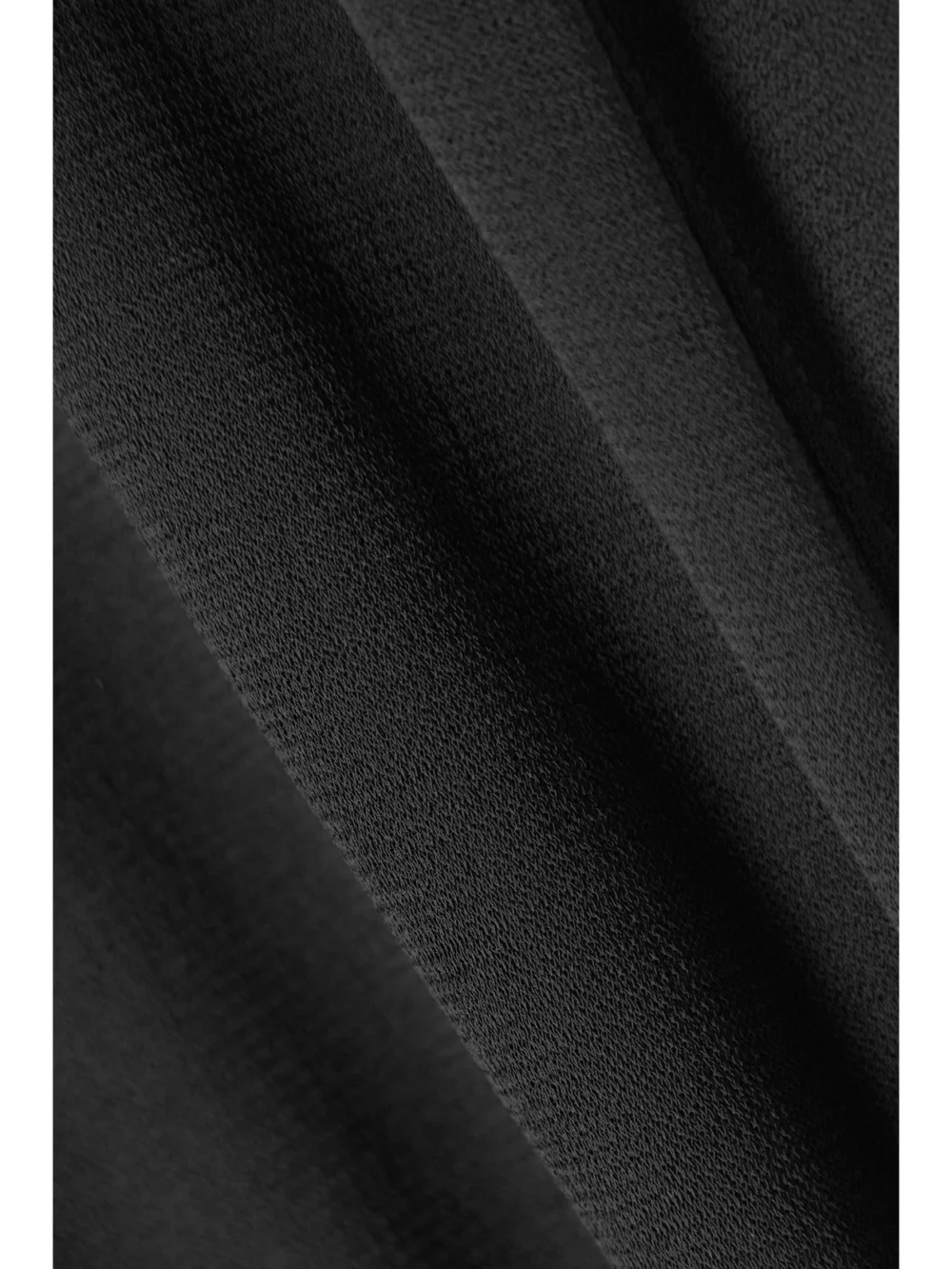 Close-up detail of the Loewe Crepe Stirrup Leggings
