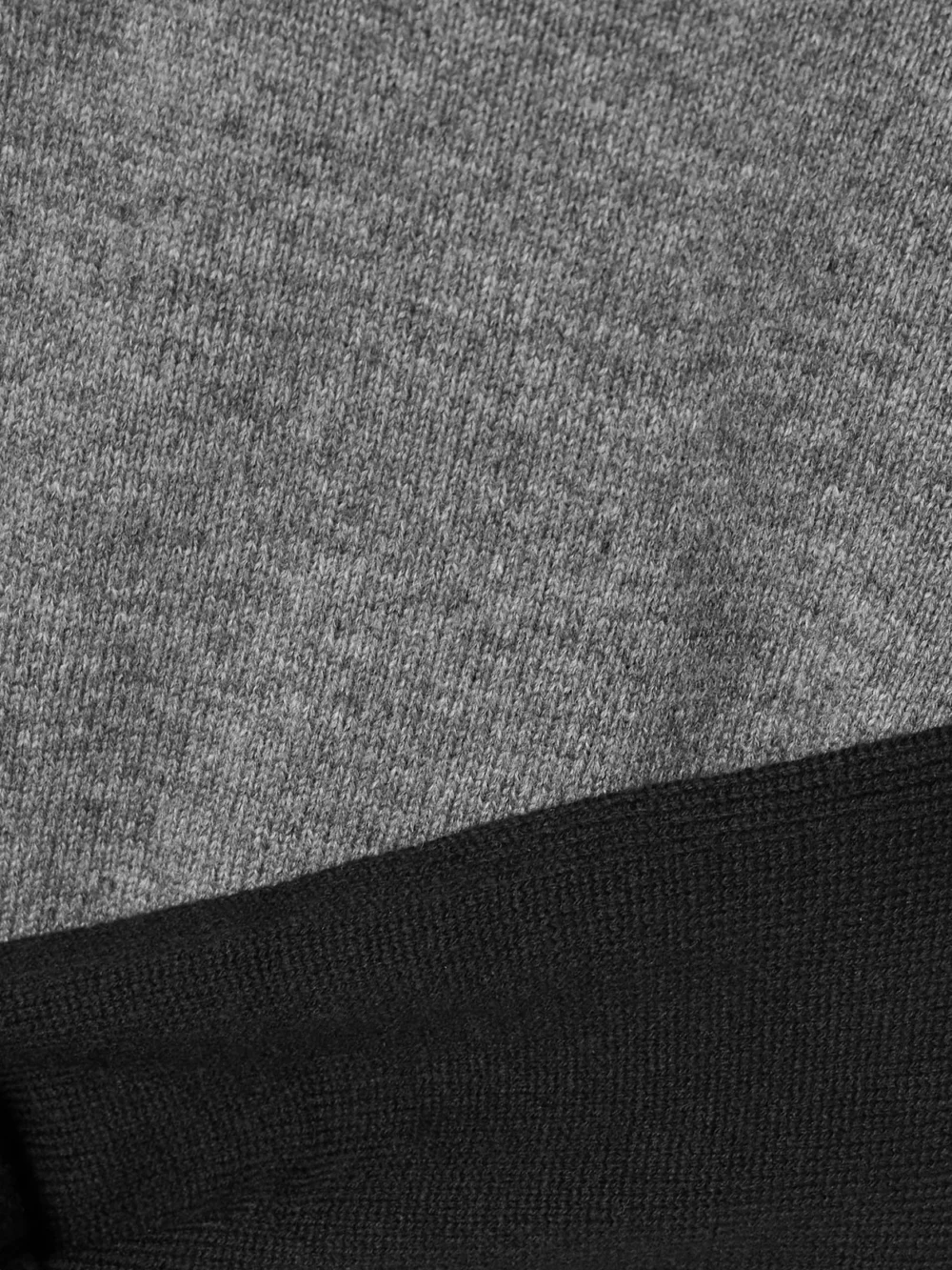 Close-up detail of the Loewe Cropped Open-back Tie-front Wool-blend Polo Shirt
