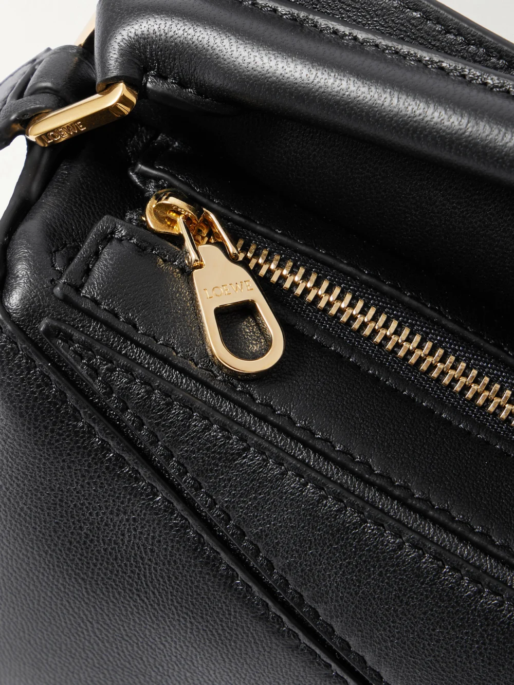 Close-up detail of the Loewe Featherlight Puzzle Mini Textured-leather Top-handle Bag