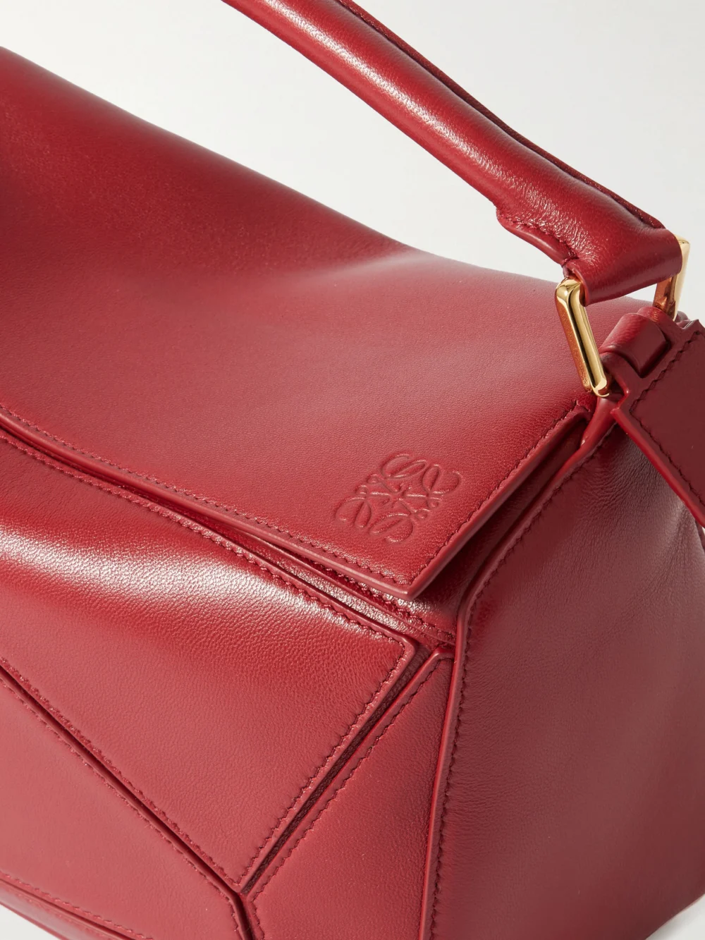 Close-up detail of the Loewe Featherlight Puzzle Small Textured-leather Top-handle Bag