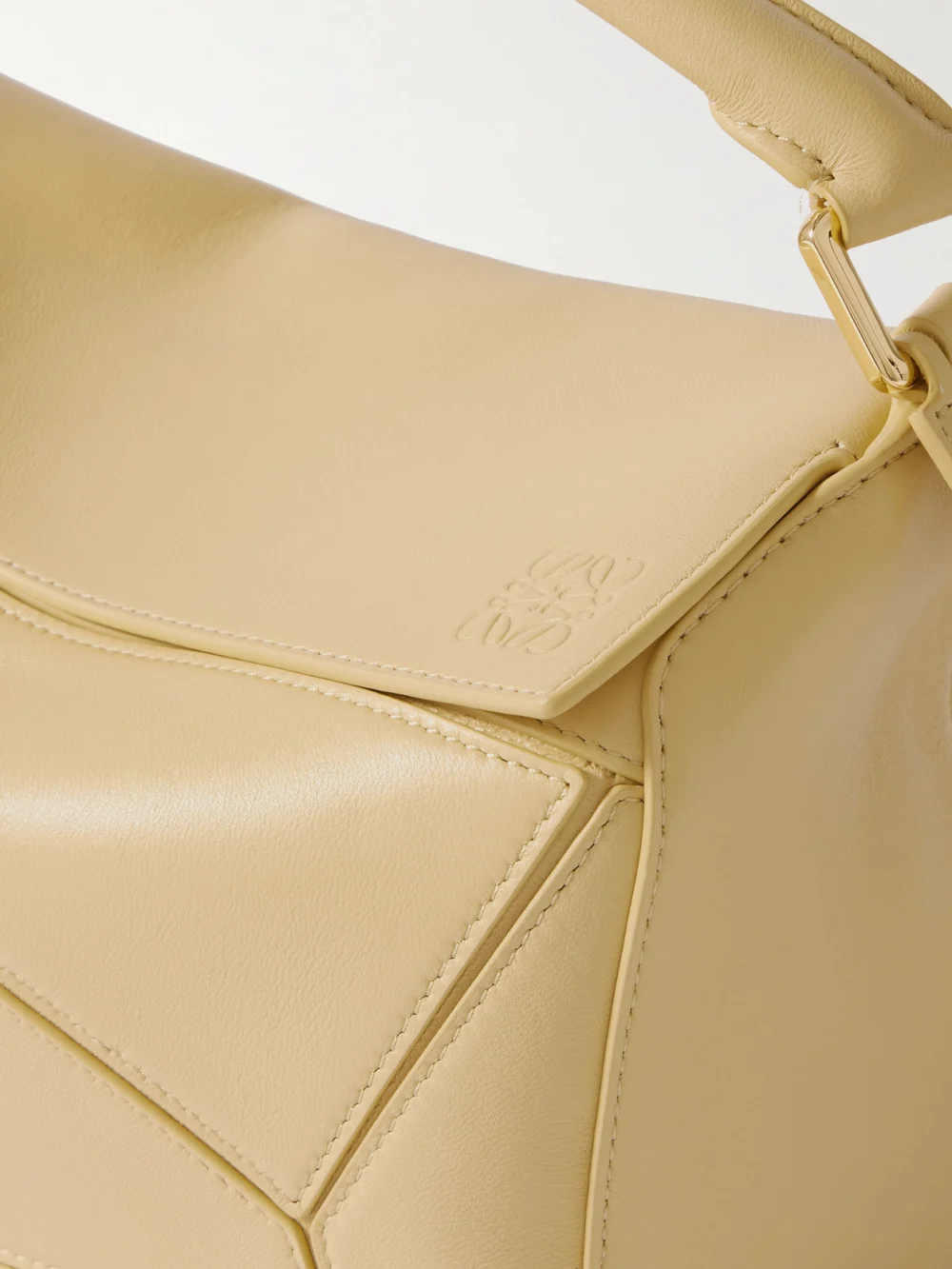 Close-up detail of the Loewe Featherlight Puzzle Small Textured-leather Top-handle Bag