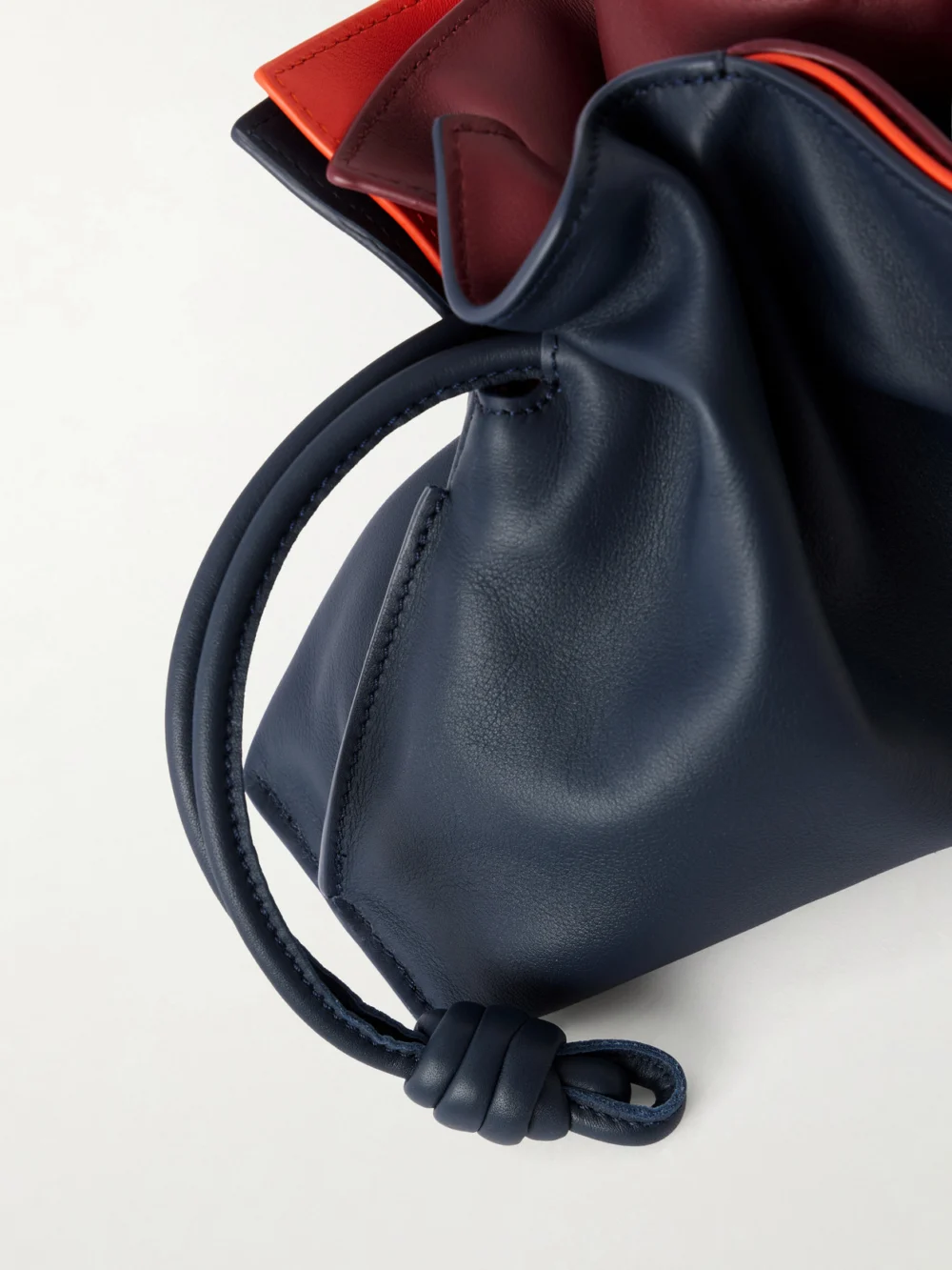 Close-up detail of the Loewe Flamenco Layers Mini Leather Clutch