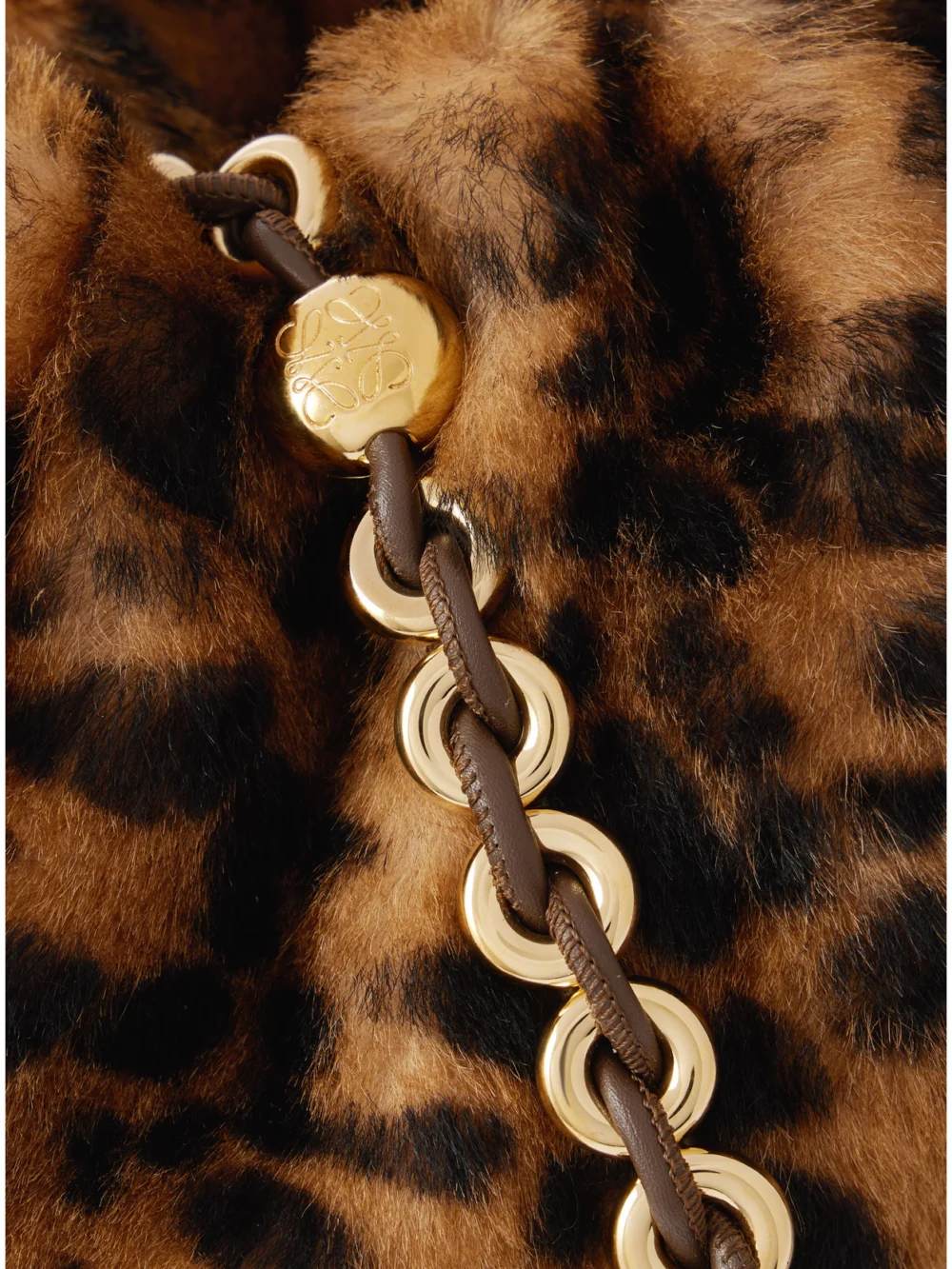 Close-up detail of the Loewe Flamenco Medium Leather-trimmed Leopard-print Shearling Clutch