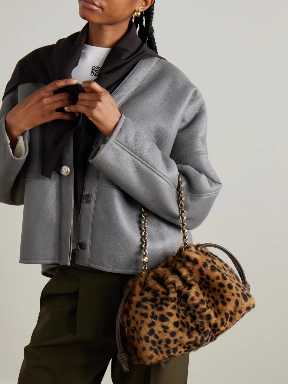 Loewe Flamenco Medium Leather-trimmed Leopard-print Shearling Clutch, styled view