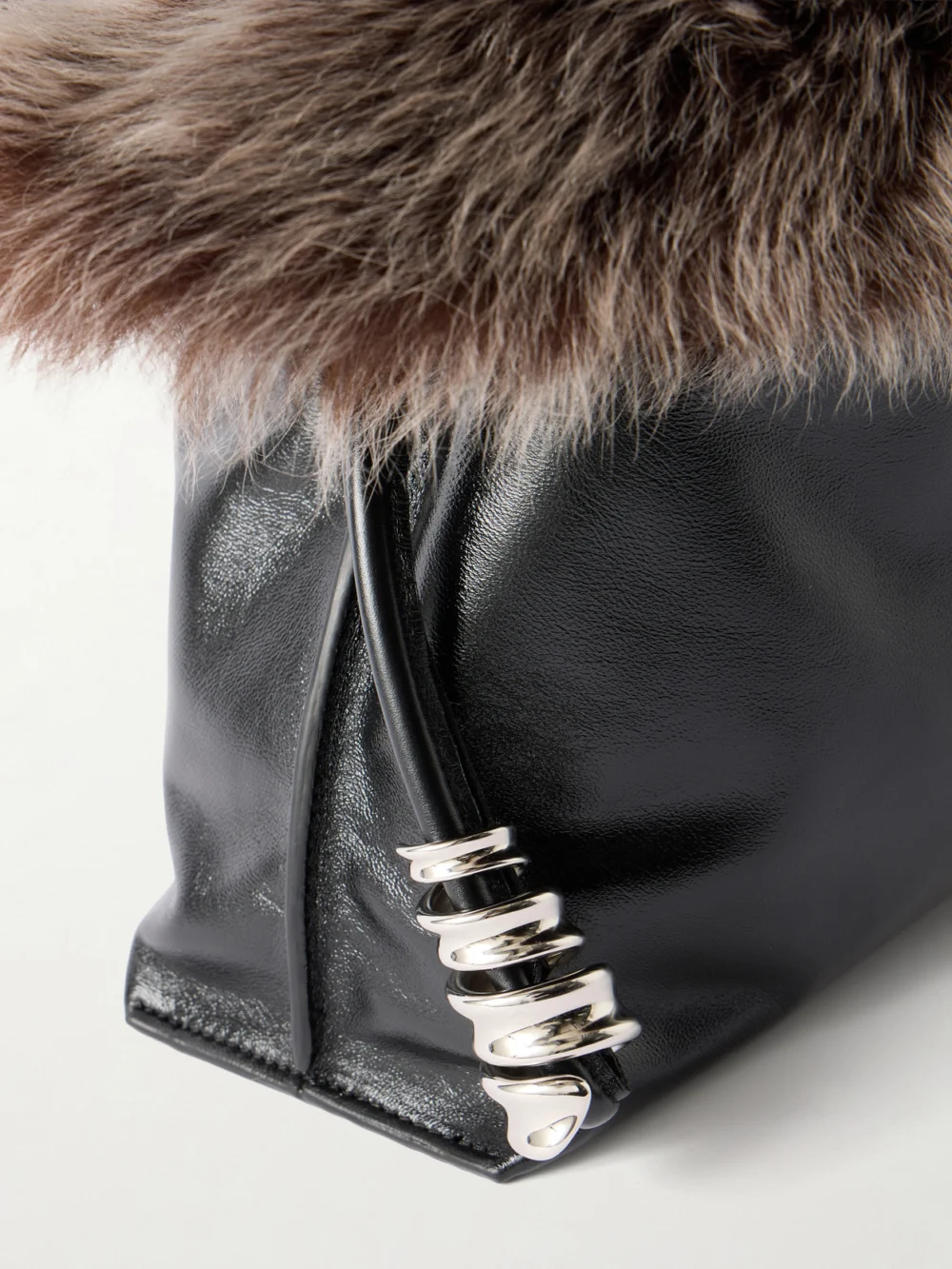 Close-up detail of the Loewe Flamenco Medium Shearling-trimmed Leather Clutch