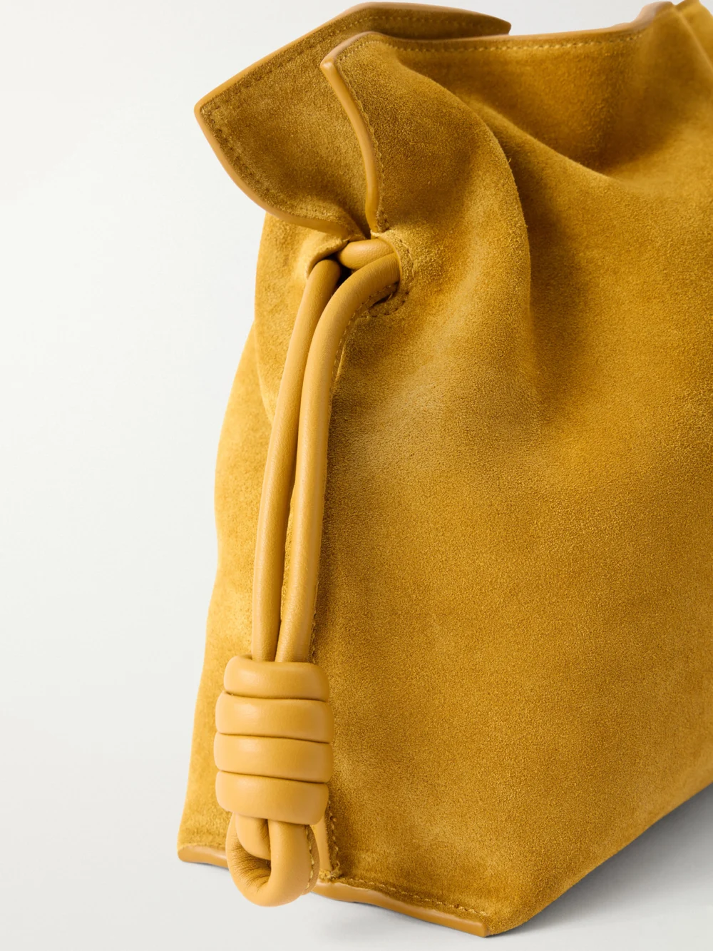 Close-up detail of the Loewe Flamenco Medium Suede Clutch