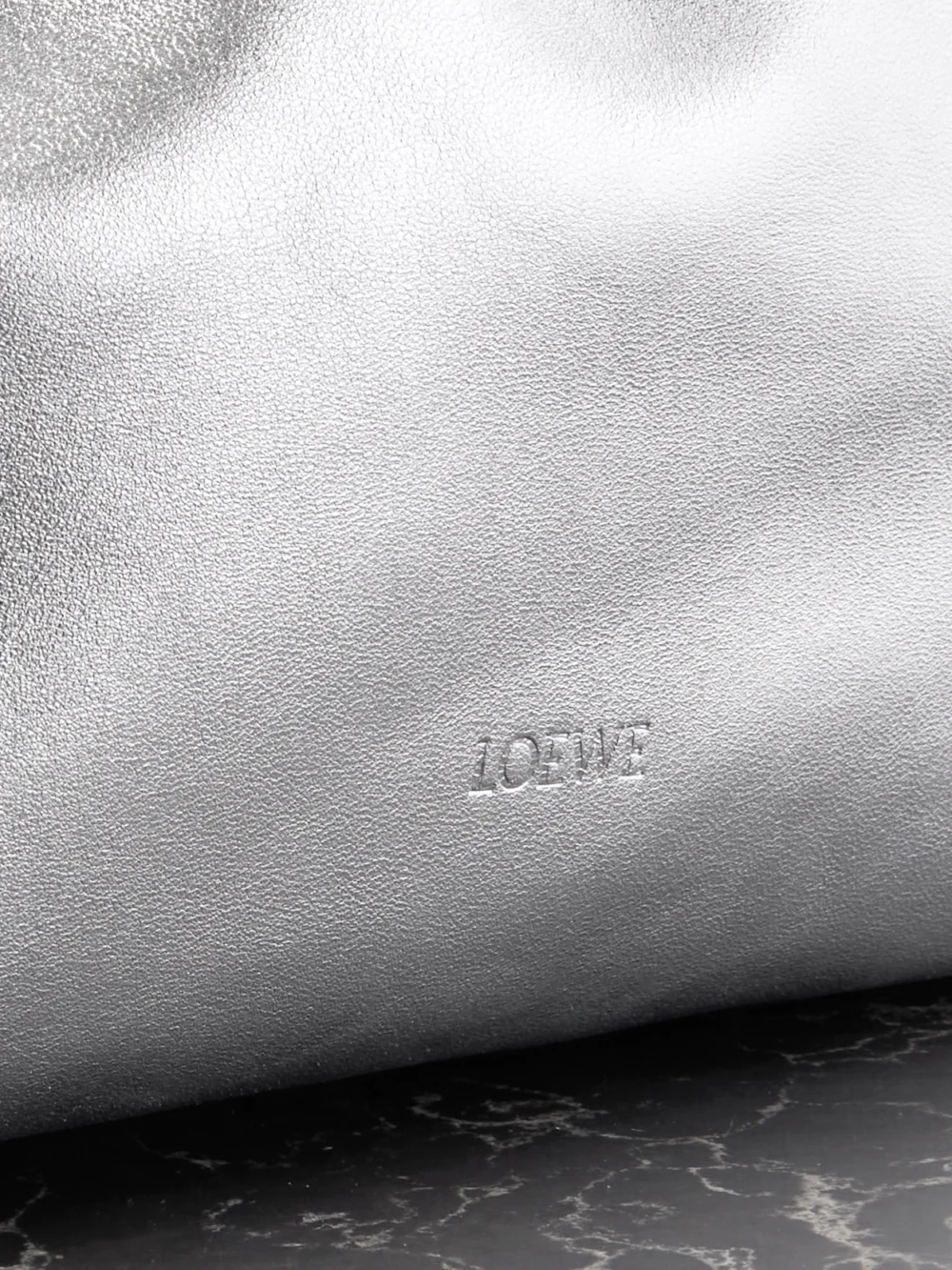 Close-up detail of the Loewe Flamenco Metallic Leather Clutch