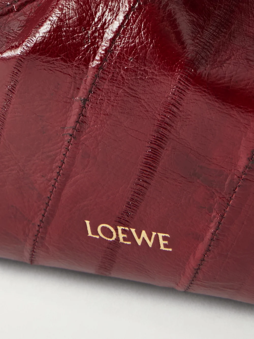 Close-up detail of the Loewe Flamenco Mini Leather-trimmed Crinkled-eel Clutch