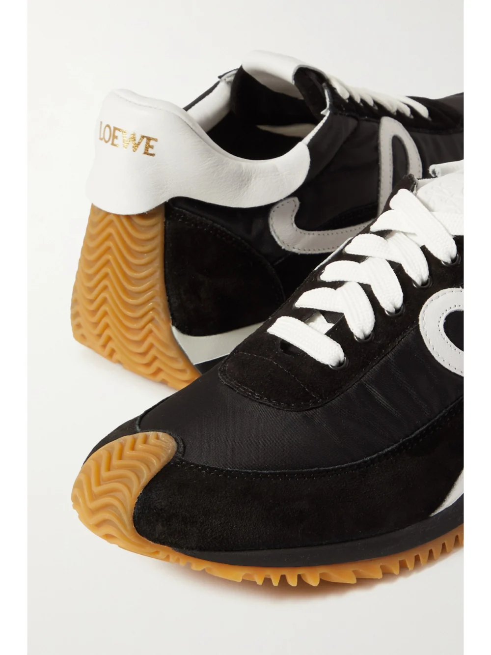 Close-up detail of the Loewe Flow Logo-appliquéd Leather and Shell Sneakers