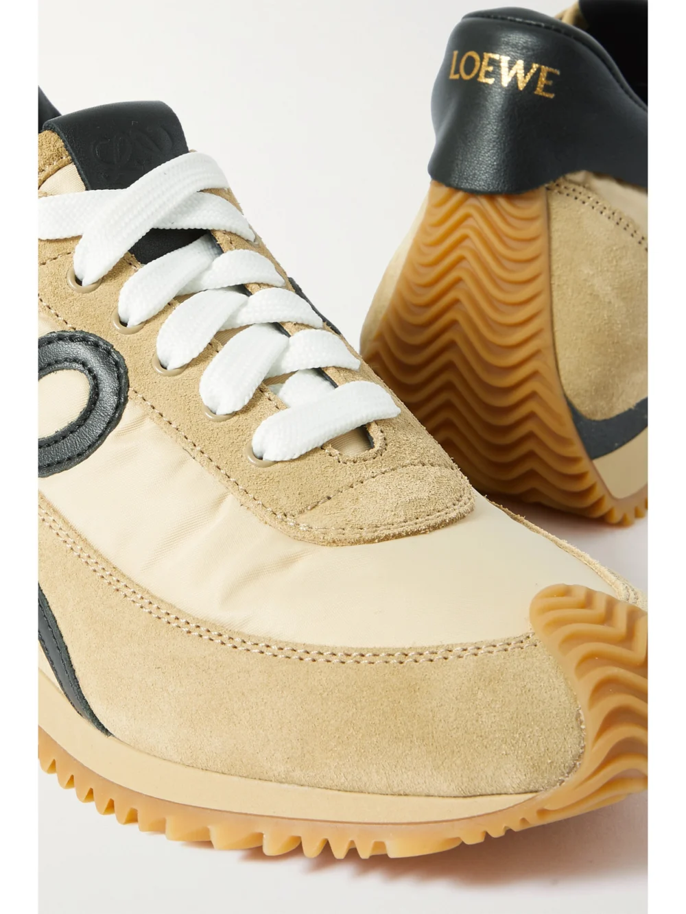 Close-up detail of the Loewe Flow Logo-appliquéd Shell, Leather and Suede Sneakers