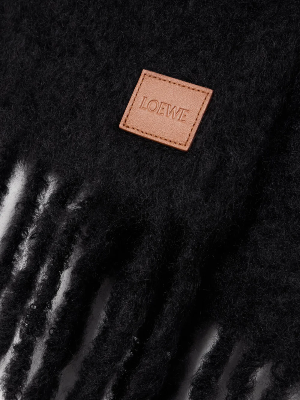 Close-up detail of the Loewe Fringed Appliquéd Leather-trimmed Brushed Mohair-blend Scarf