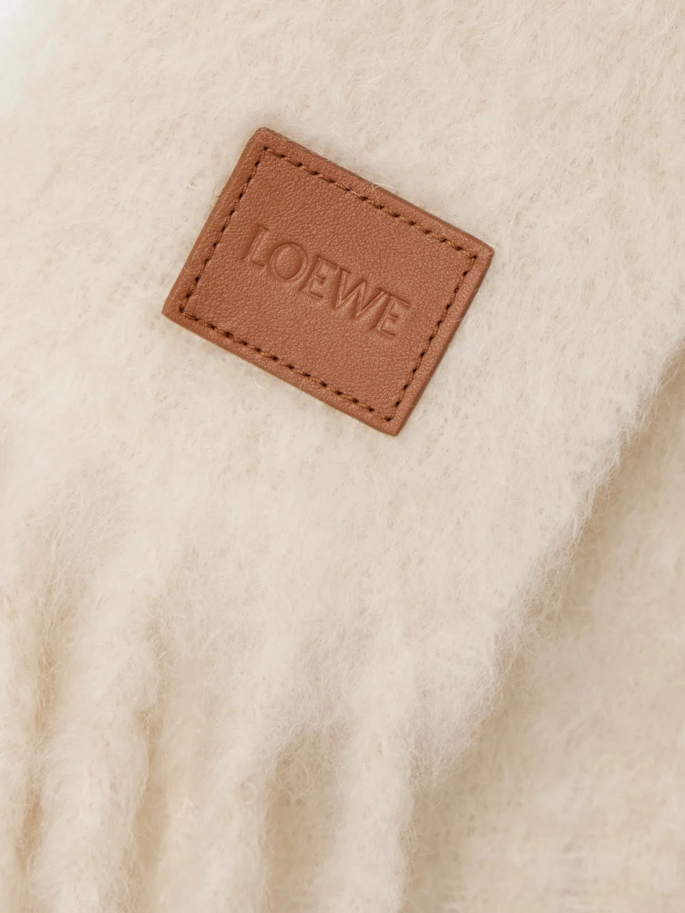 Close-up detail of the Loewe Fringed Appliquéd Leather-trimmed Brushed Mohair-blend Scarf
