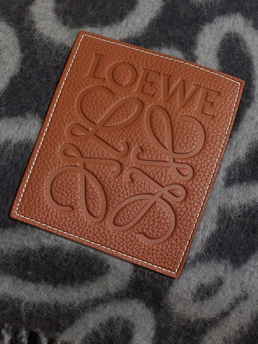 Close-up detail of the Loewe Fringed Leather-trimmed Alpaca-blend Jacquard Blanket