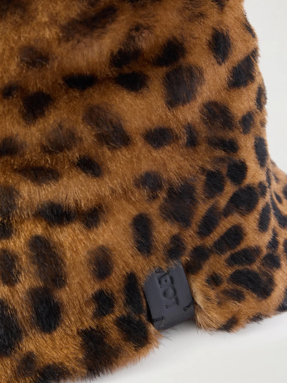 Close-up detail of the Loewe Leather-trimmed Leopard-print Shearling Bucket Hat