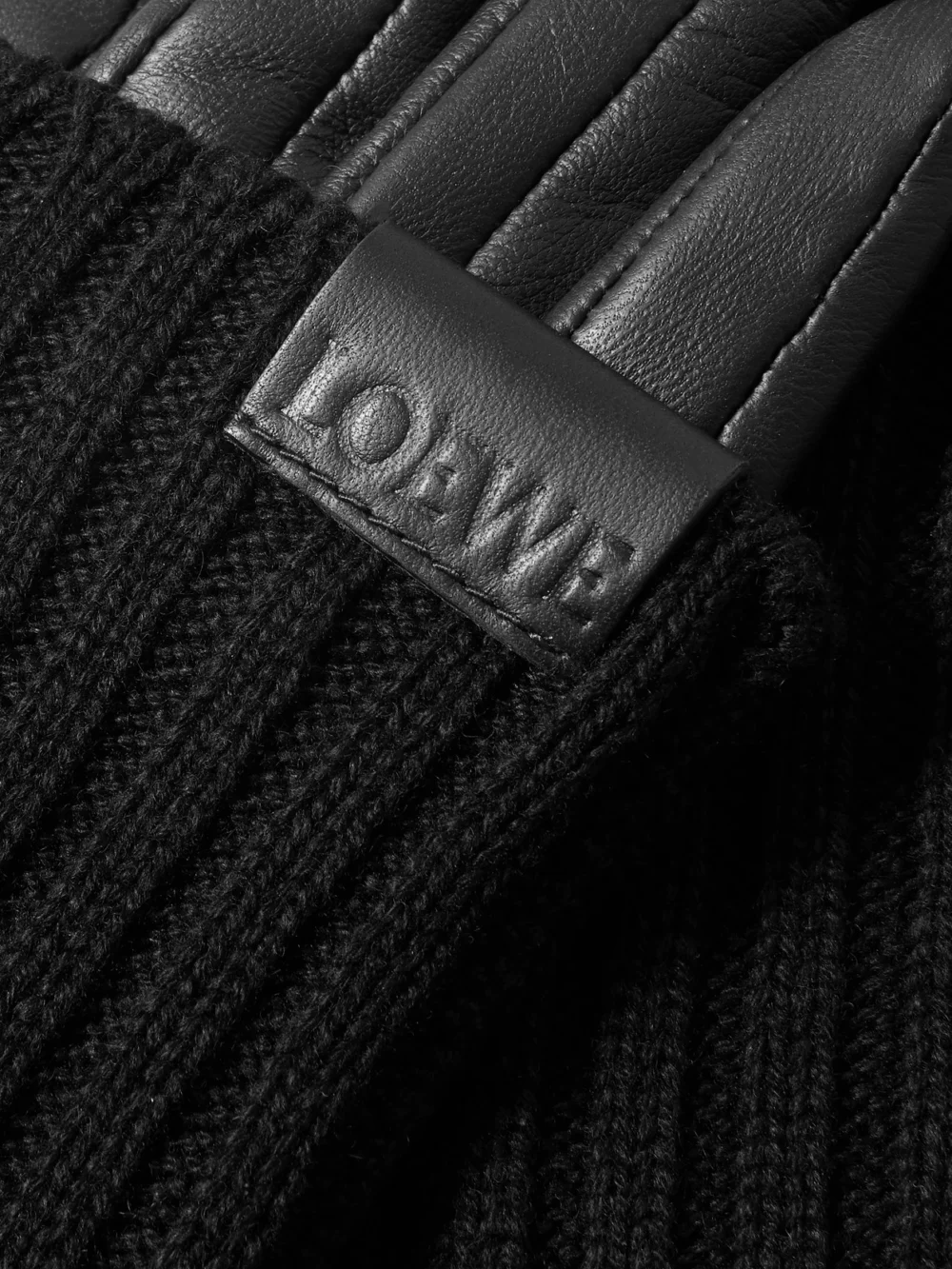 Close-up detail of the Loewe Leather-trimmed Ribbed Cashmere Gloves