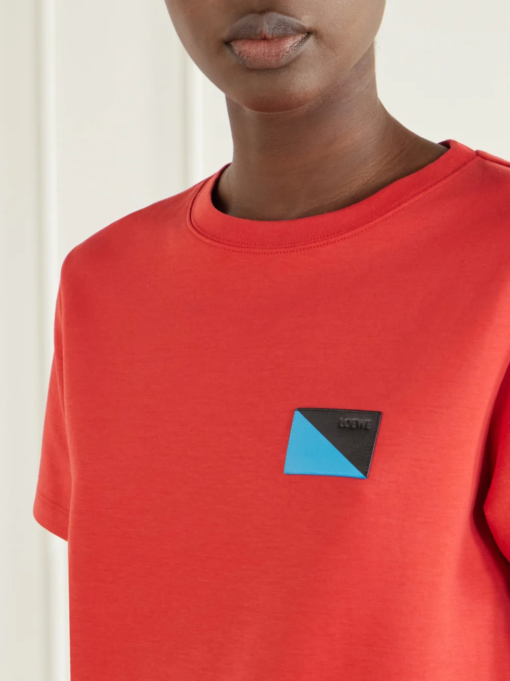 Close-up detail of the Loewe Logo-embossed Leather-trimmed Cotton-blend Jersey T-shirt