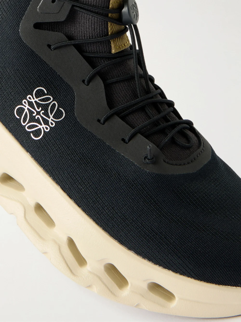 Close-up detail of the Loewe + on Cloudtilt Sneakers