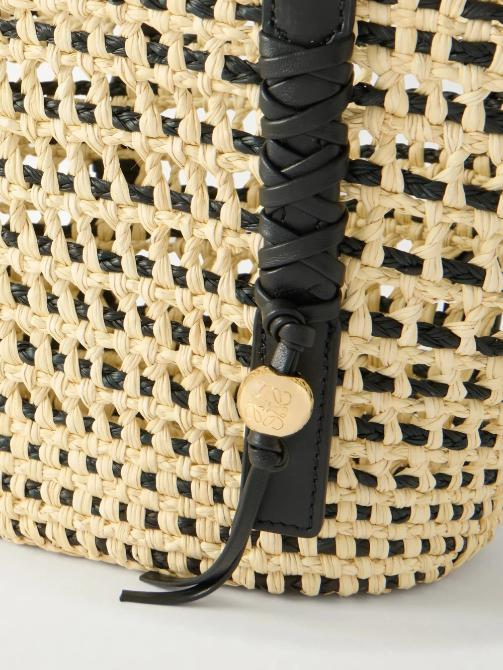 Close-up detail of the Loewe + Paula's Ibiza Braid Basket Small Leather-trimmed Raffia Shoulder Bag