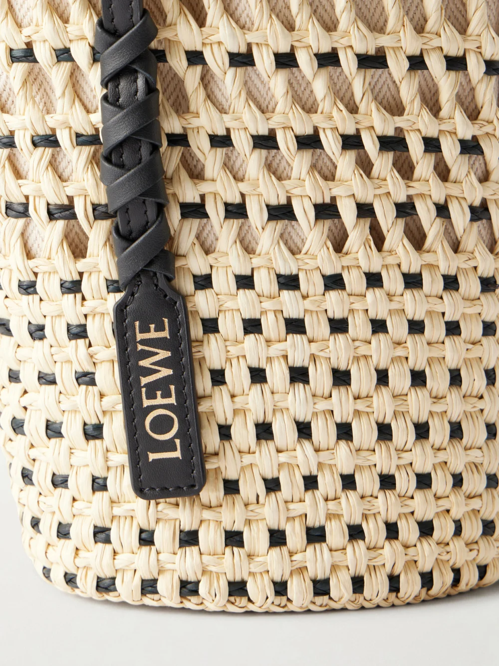 Close-up detail of the Loewe + Paula's Ibiza Braid Leather-trimmed Raffia Shoulder Bag