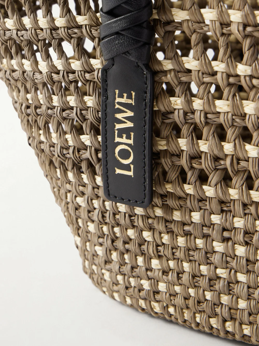 Close-up detail of the Loewe + Paula's Ibiza Braid Medium Leather-trimmed Raffia Tote