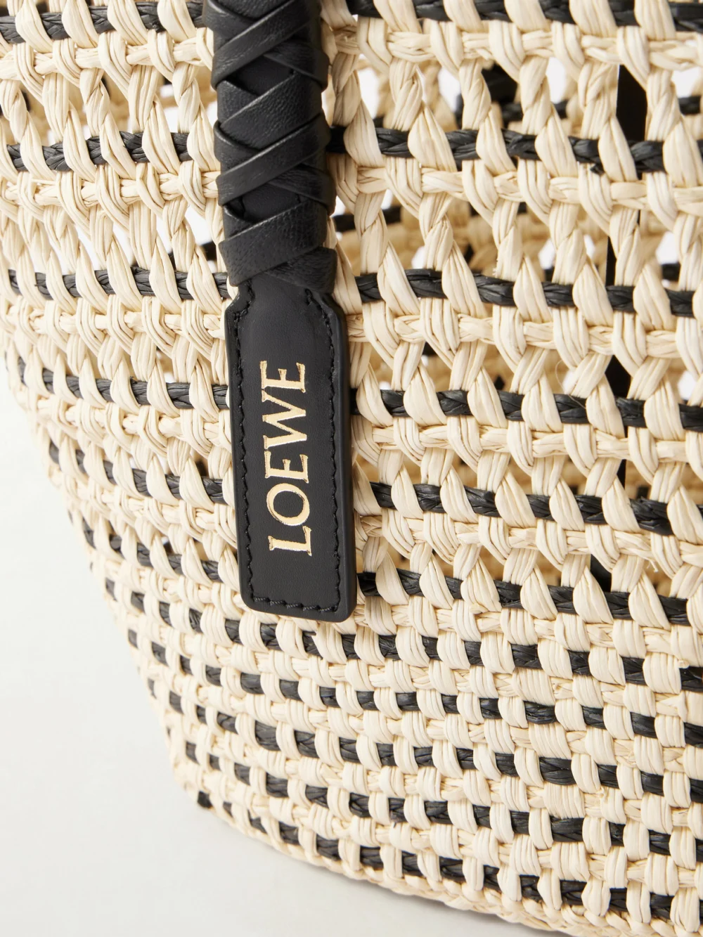 Close-up detail of the Loewe + Paula's Ibiza Braid Medium Leather-trimmed Raffia Tote