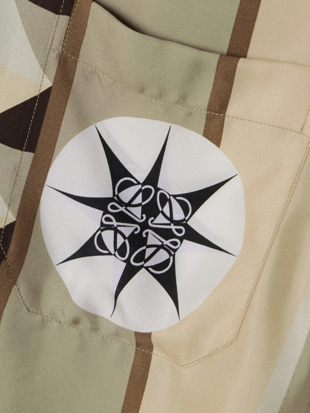 Close-up detail of the Loewe + Paula's Ibiza Cropped Printed Silk-twill Shirt
