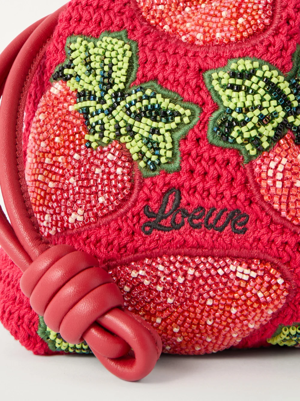 Close-up detail of the Loewe + Paula's Ibiza Flamenco Leather-trimmed Beaded Clutch Bag