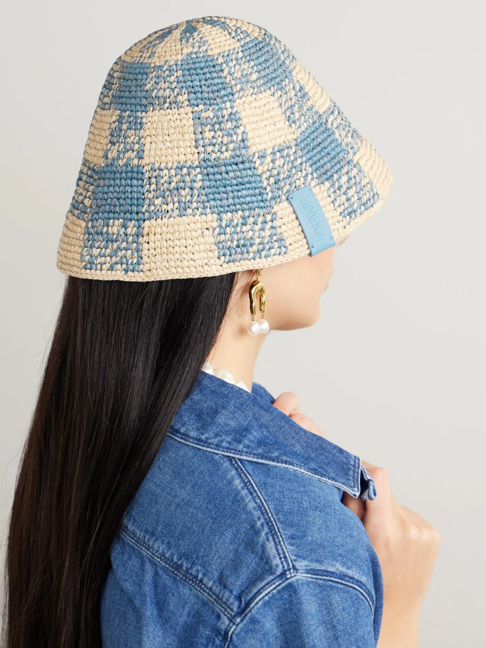 Loewe + Paula's Ibiza Leather-trimmed Checked Raffia Bucket Hat, styled view