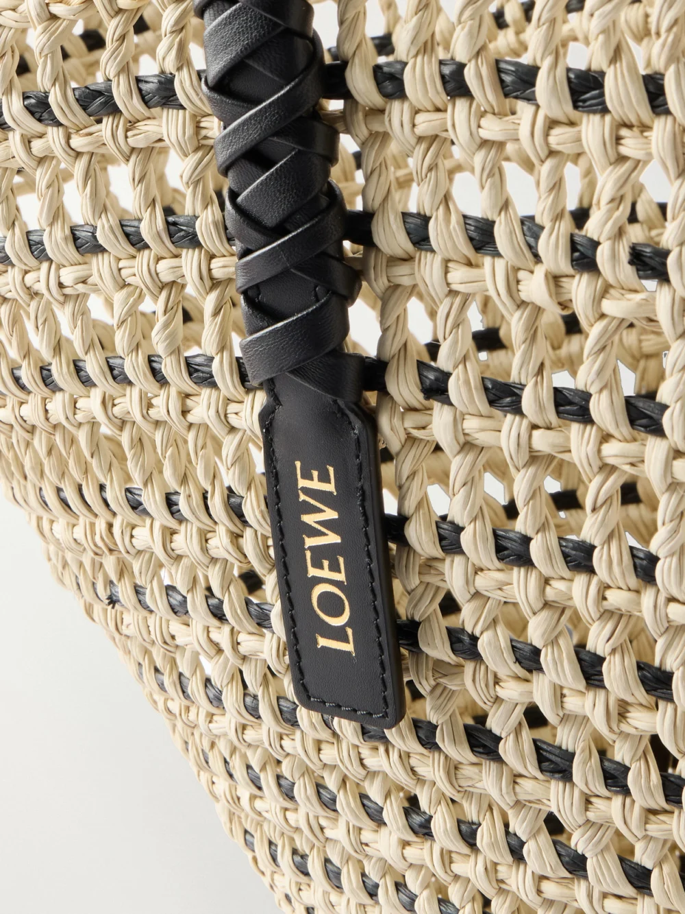 Close-up detail of the Loewe + Paula's Ibiza Leather-trimmed Iraca Tote