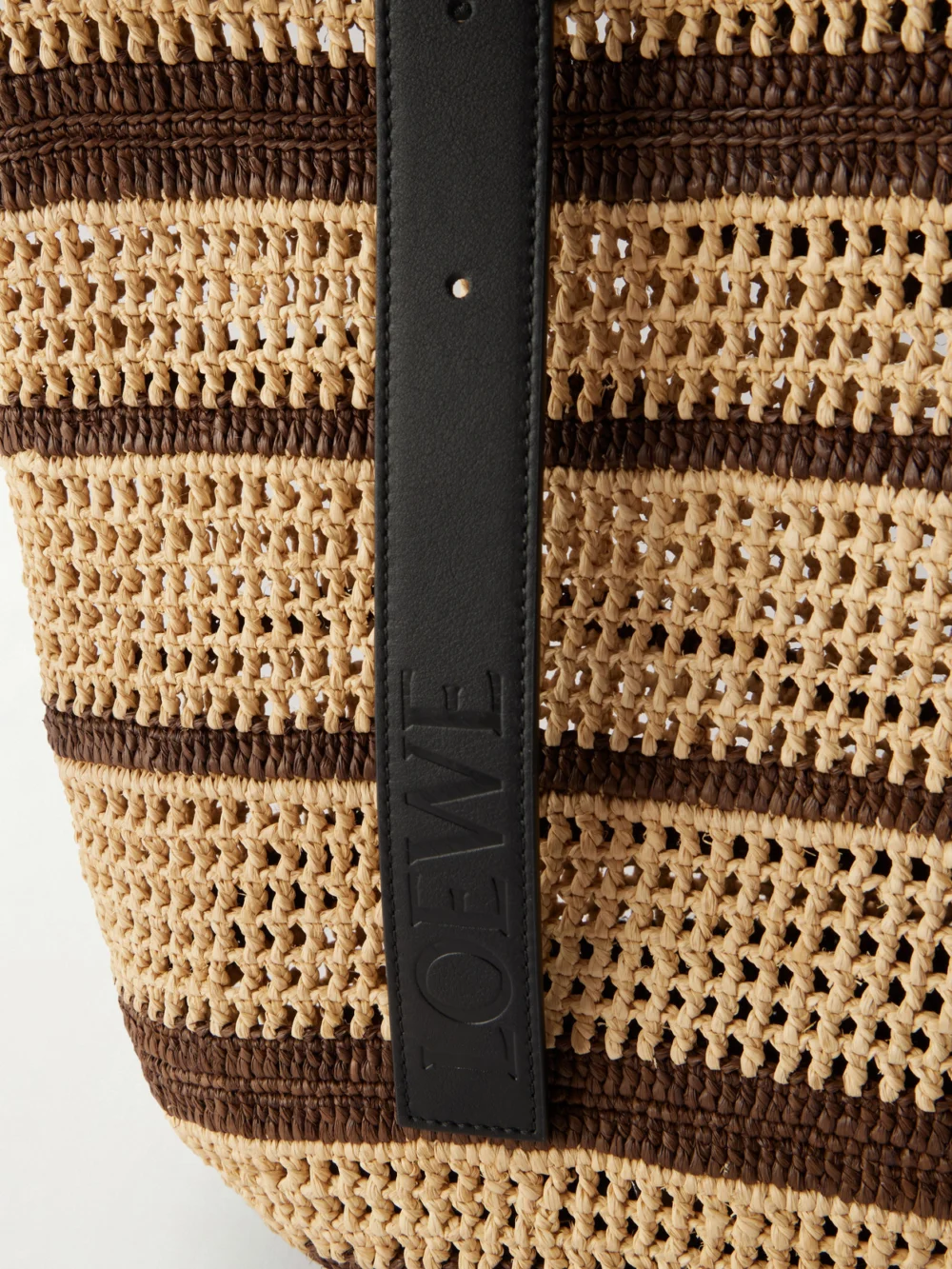 Close-up detail of the Loewe + Paula's Ibiza Loop Basket Leather-trimmed Raffia Tote