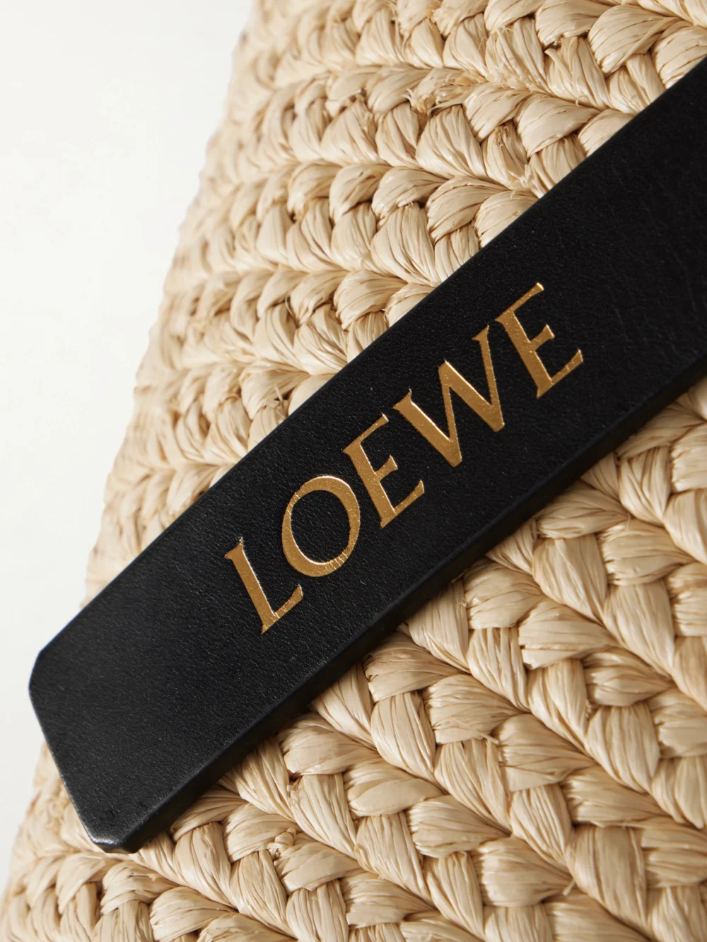 Close-up detail of the Loewe + Paula's Ibiza Punch Hole Small Leather-trimmed Raffia Tote