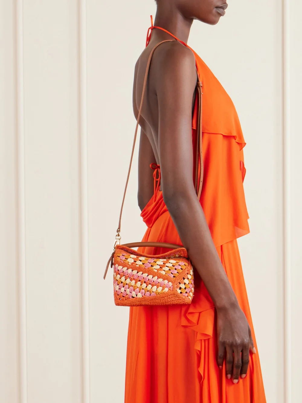 Loewe + Paula's Ibiza Puzzle Edge Mini Leather-trimmed Crocheted Raffia Shoulder Bag, styled view