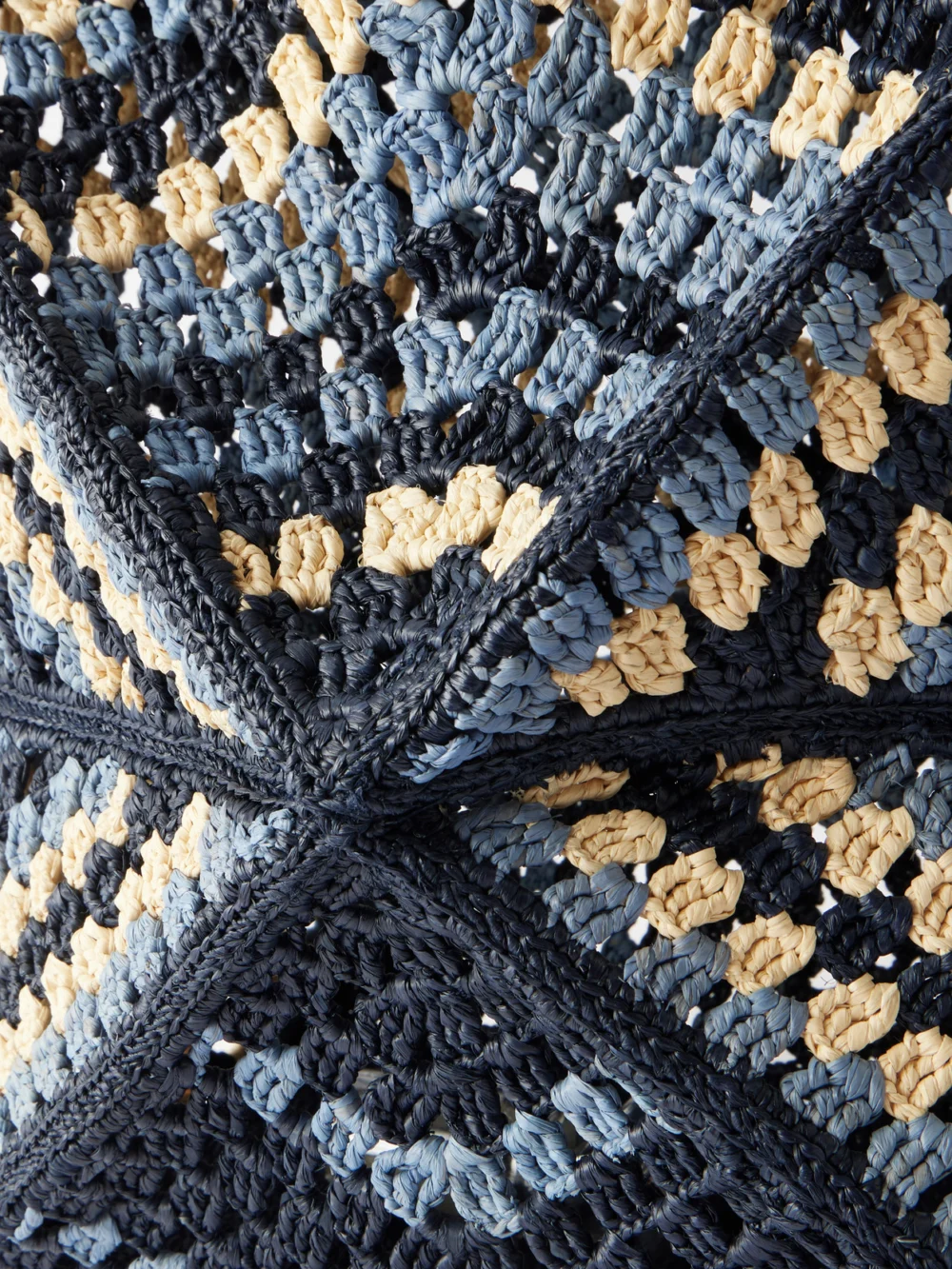 Close-up detail of the Loewe + Paula's Ibiza Puzzle Fold Large Leather-trimmed Raffia Shoulder Bag