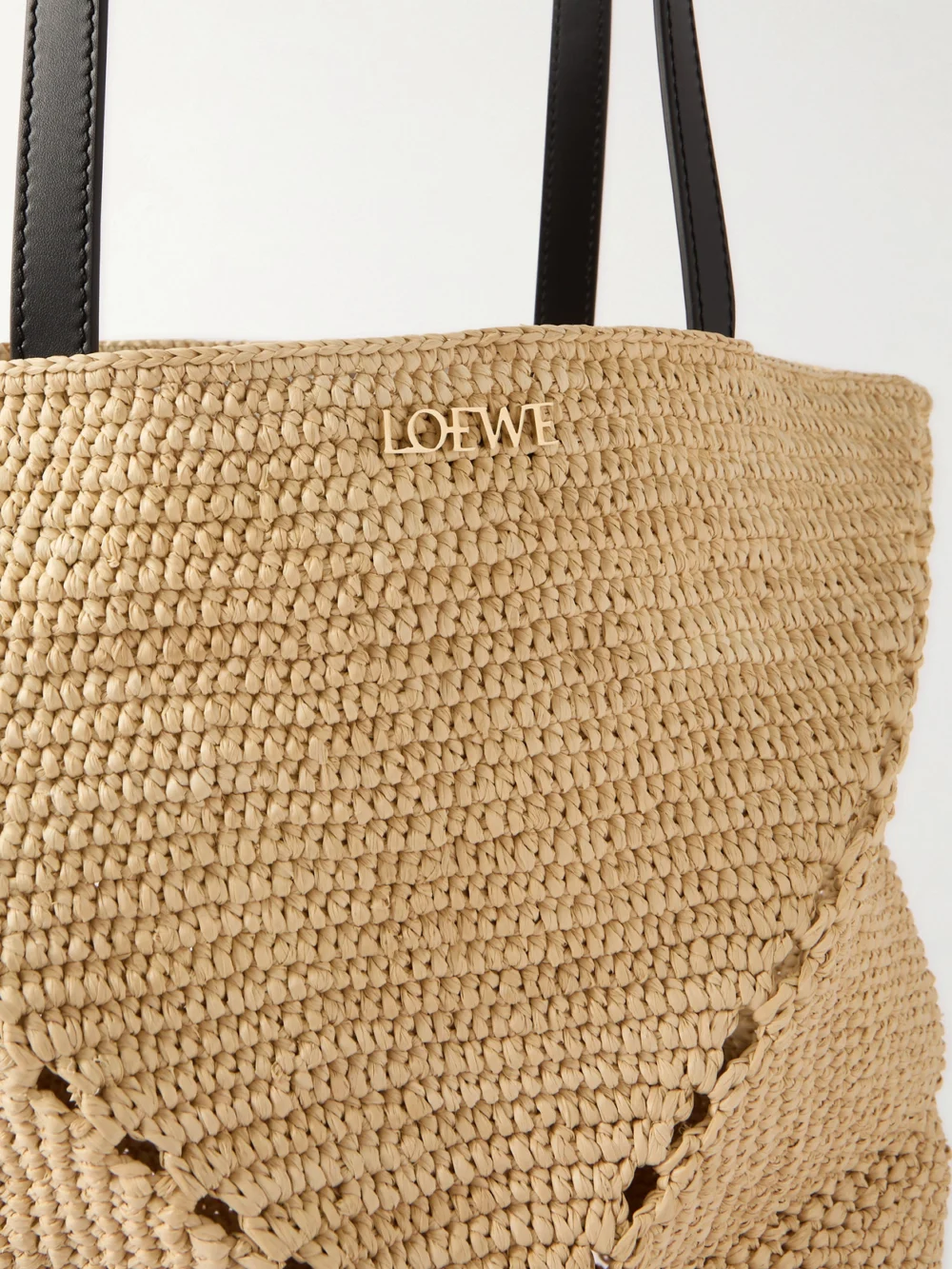 Close-up detail of the Loewe + Paula's Ibiza Puzzle Fold Medium Leather-trimmed Raffia Tote