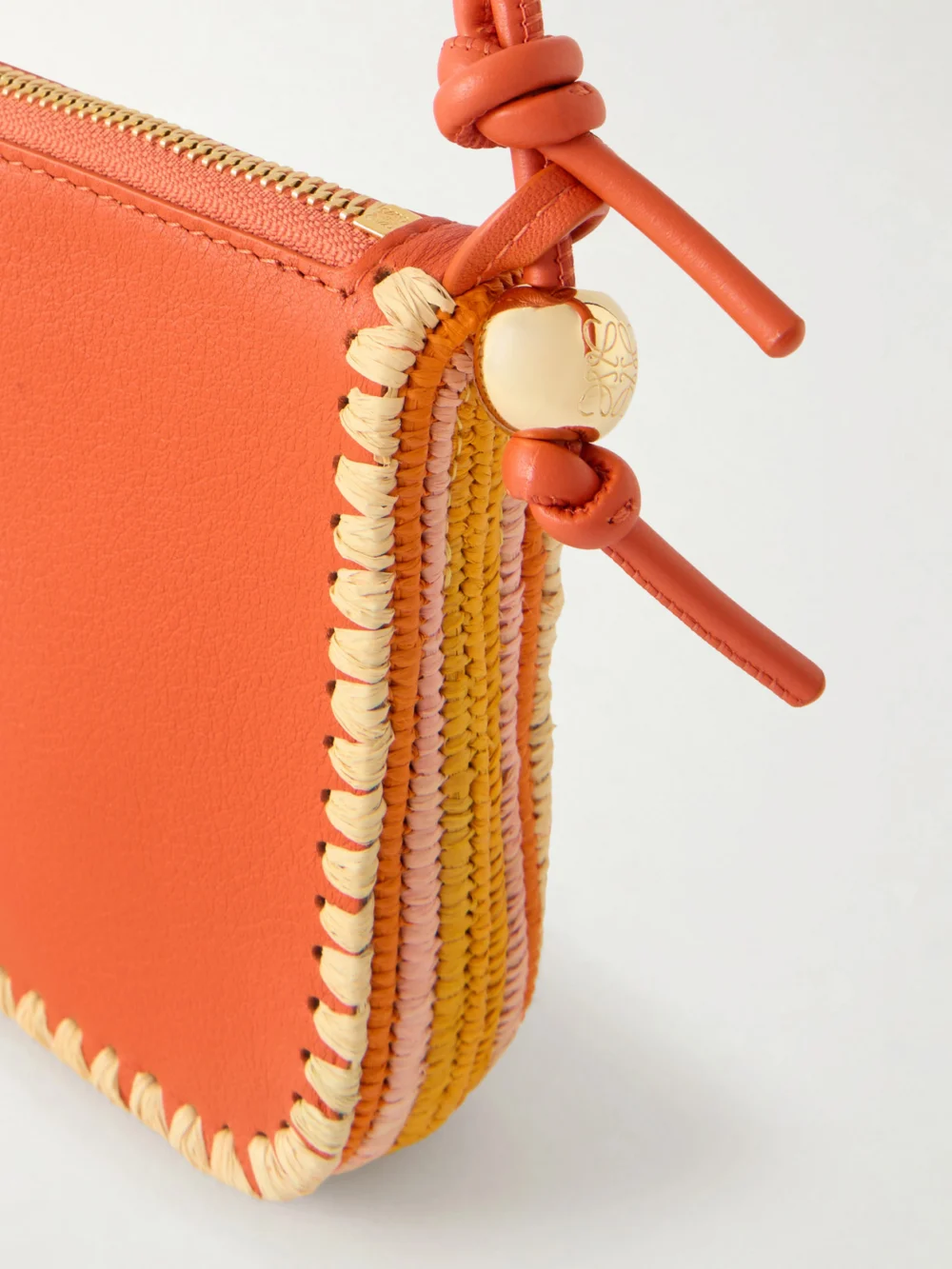 Close-up detail of the Loewe + Paula's Ibiza Rio Raffia-trimmed Leather Shoulder Bag
