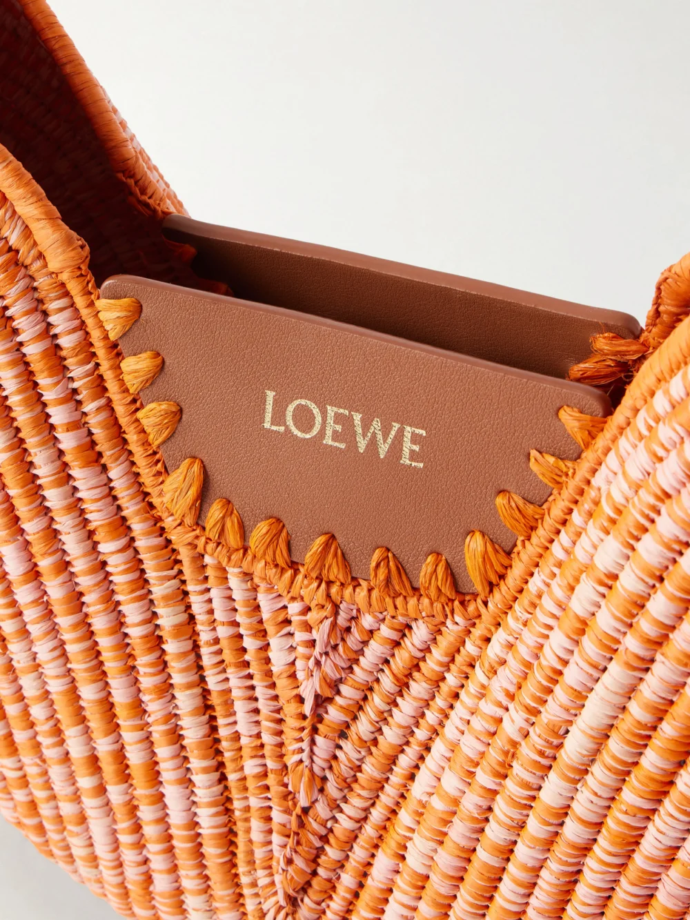 Close-up detail of the Loewe + Paula's Ibiza Swing Medium Leather-trimmed Raffia Shoulder Bag