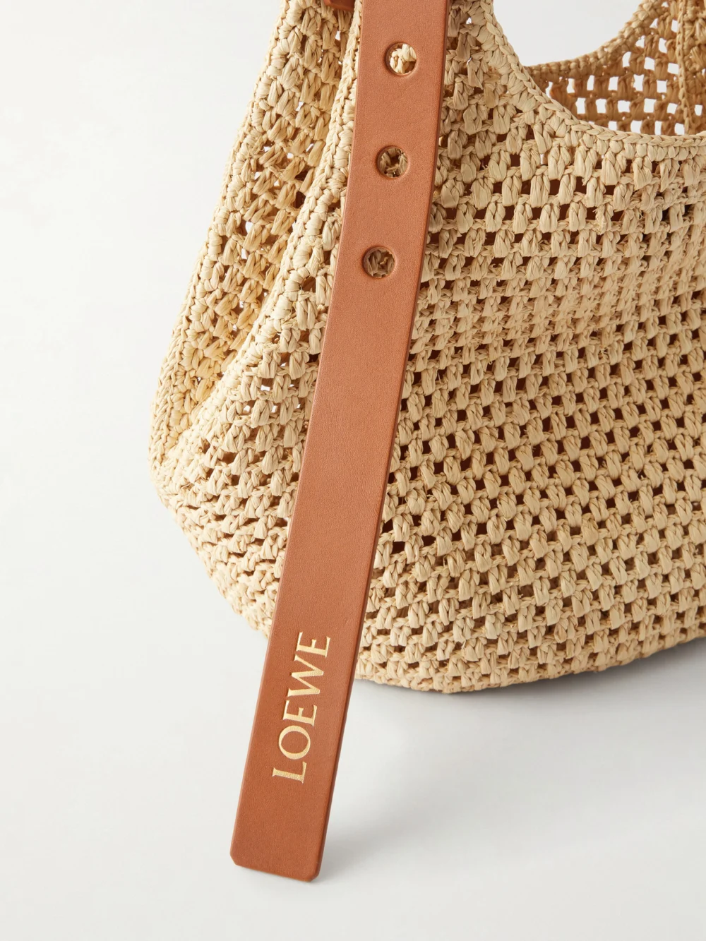 Close-up detail of the Loewe + Paula's Ibiza the Punch Hole Leather-trimmed Raffia Shoulder Bag