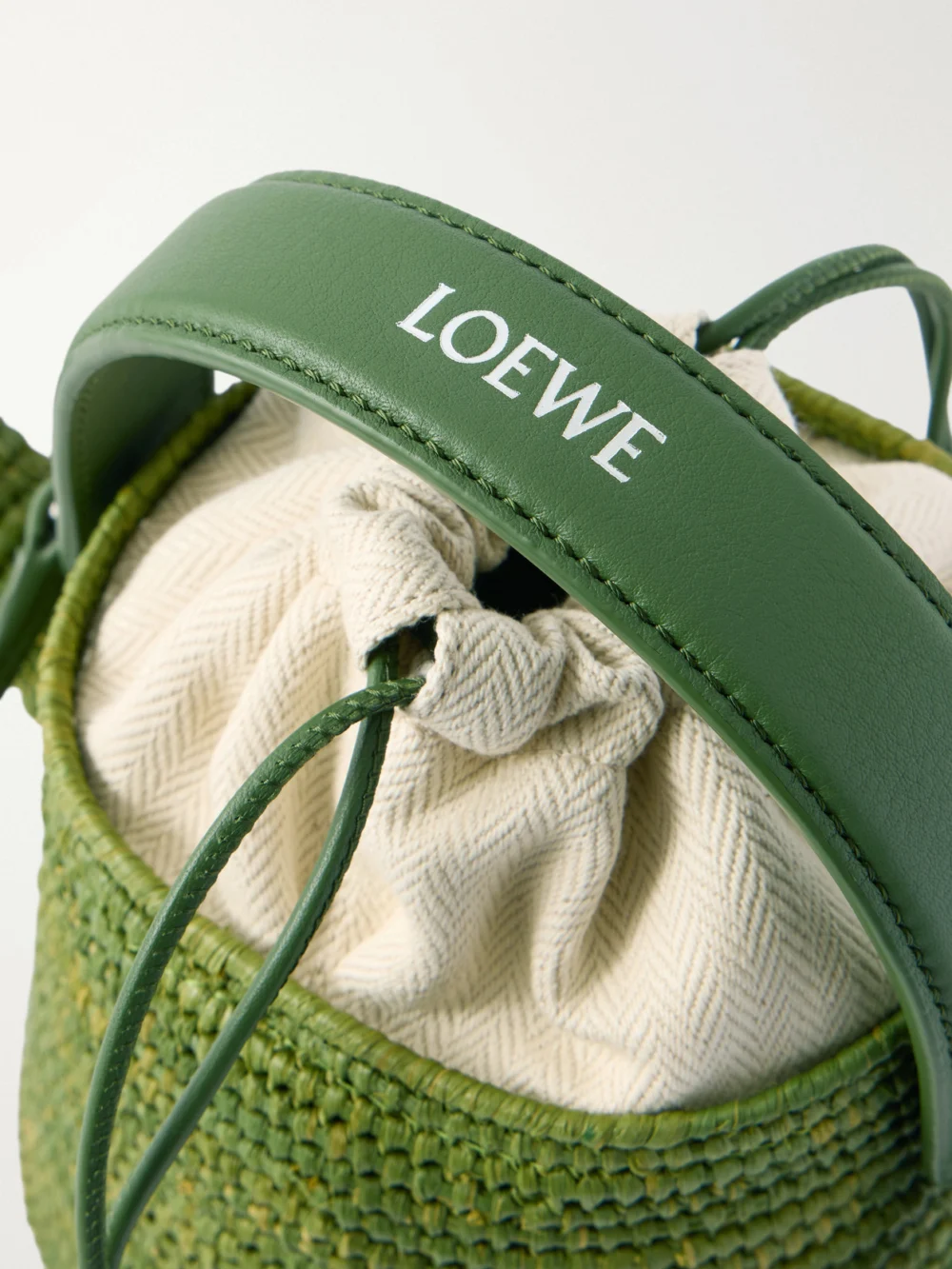 Close-up detail of the Loewe + Paula's Ibiza Watering Can Leather-trimmed Raffia Shoulder Bag