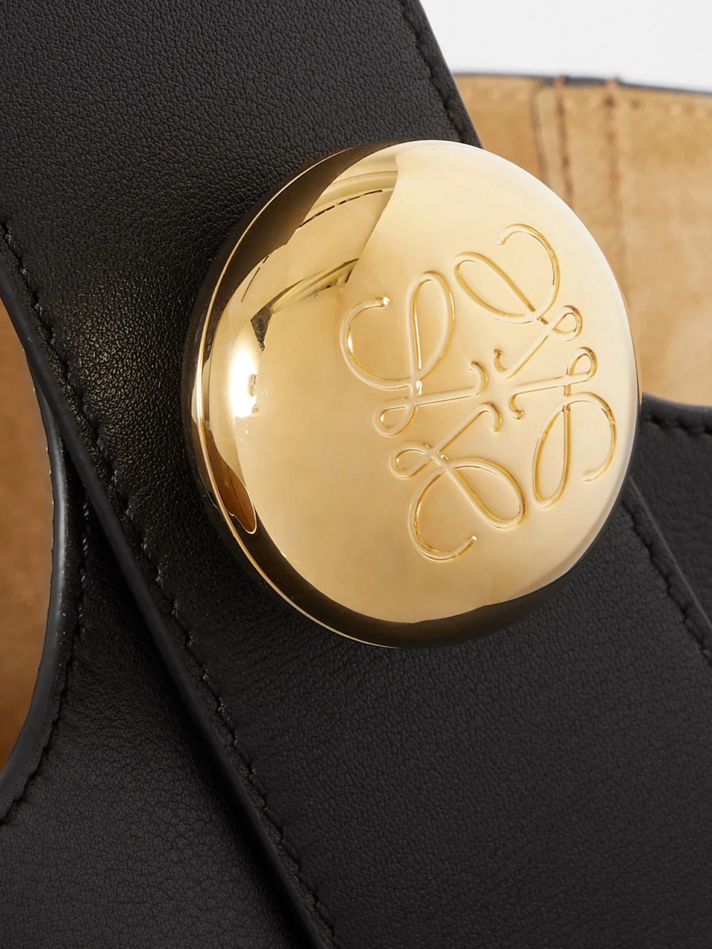 Close-up detail of the Loewe Pebble Embellished Leather Bucket Bag