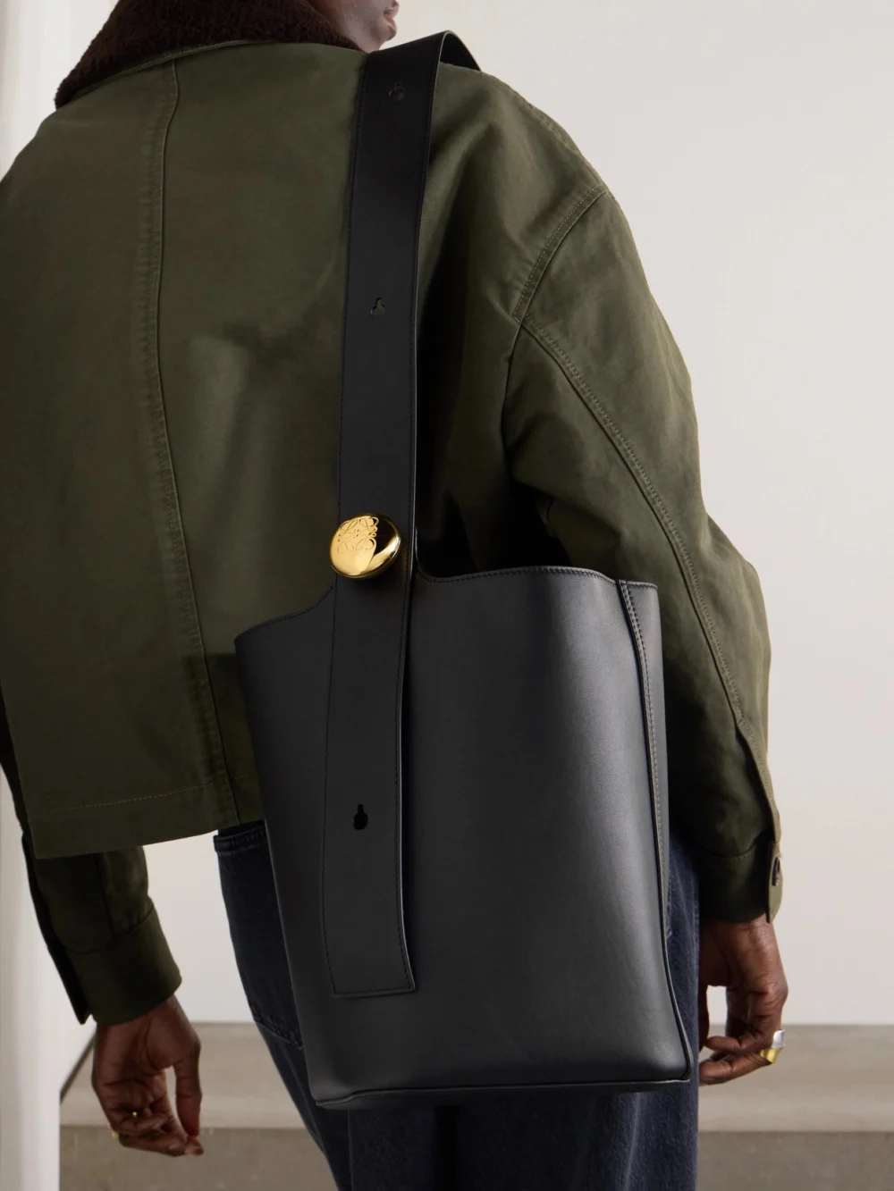 Loewe Pebble Embellished Leather Bucket Bag, styled view