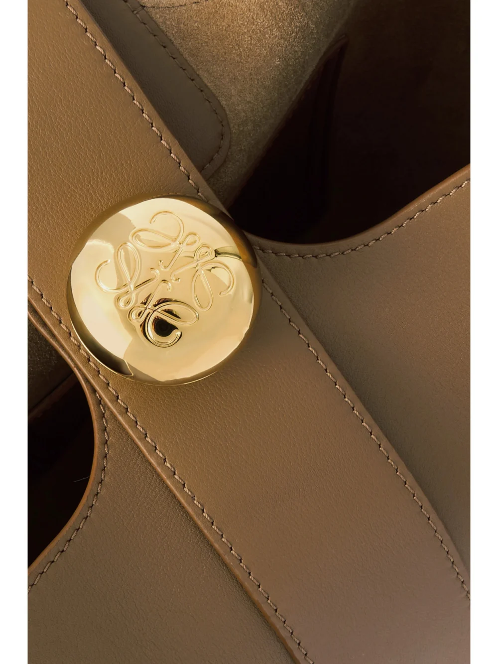 Close-up detail of the Loewe Pebble Embellished Leather Bucket Bag