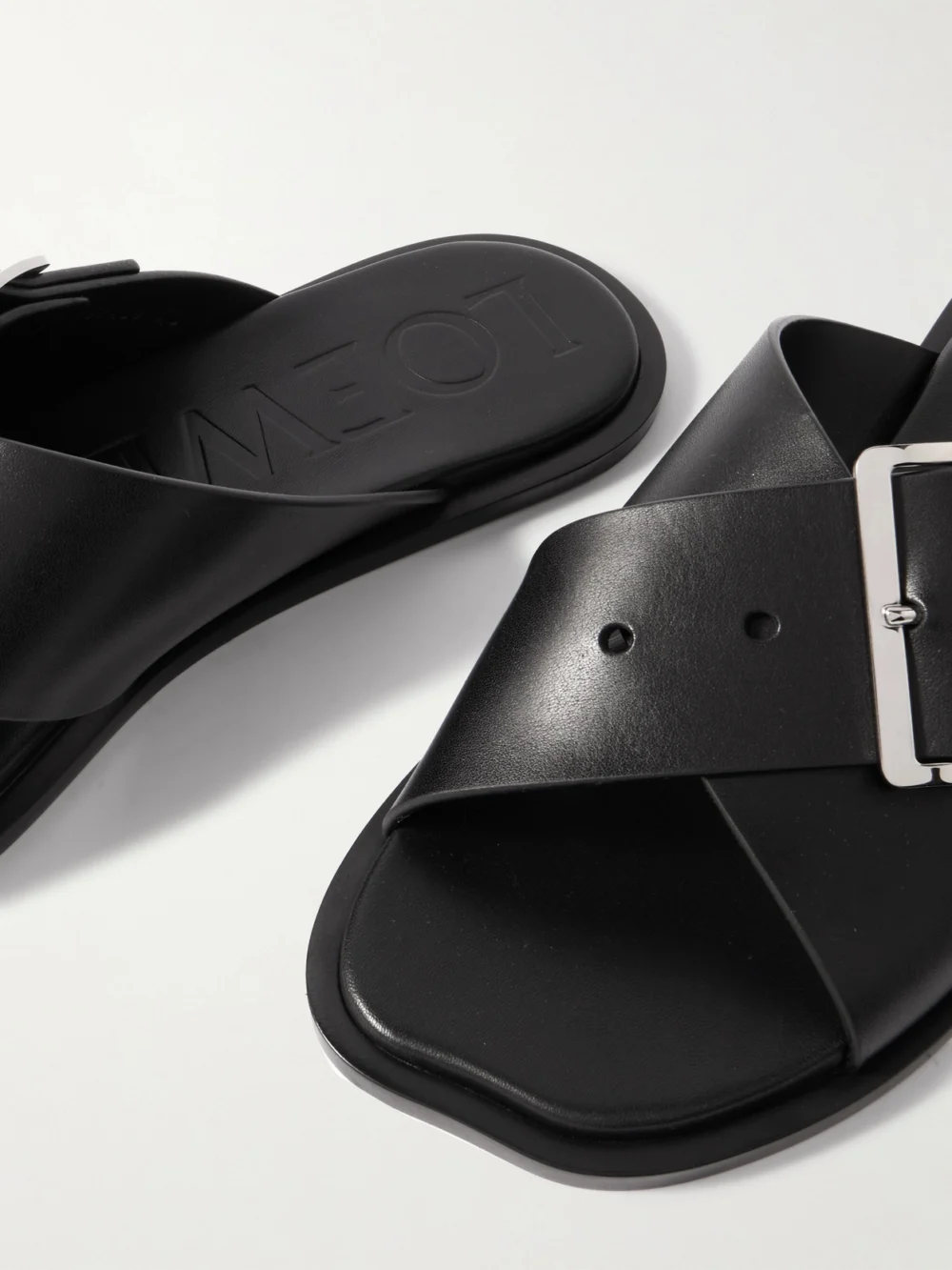 Close-up detail of the Loewe Petal Belt Buckled Leather Slides