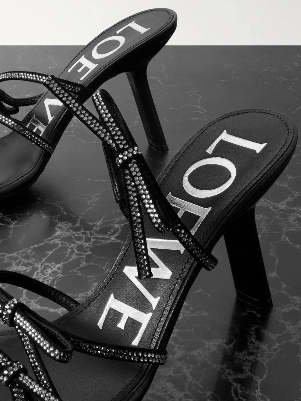 Close-up detail of the Loewe Petal Bow Crystal-embellished Suede Sandals